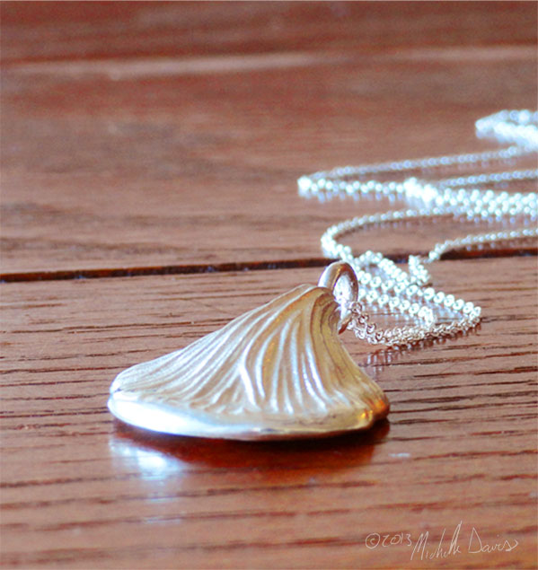 Oyster mushroom pendant in silver in perspective by Michelle Davis